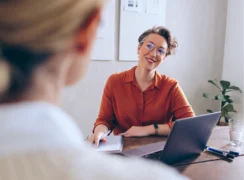 Two people sitting and meeting in HR context
