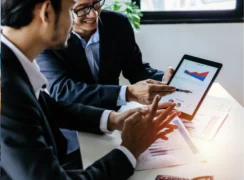 Business people looking at a graph on a tablet